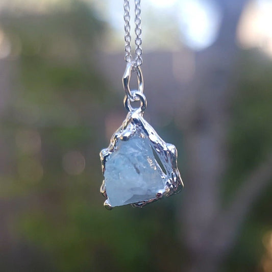 A Pendant Necklace Made of Raw, Natural Aquamarine Silver with a Branch Setting