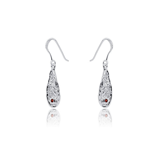 angle view of garnet gemstone teardrop sterling silver dangle earrings with organic textures