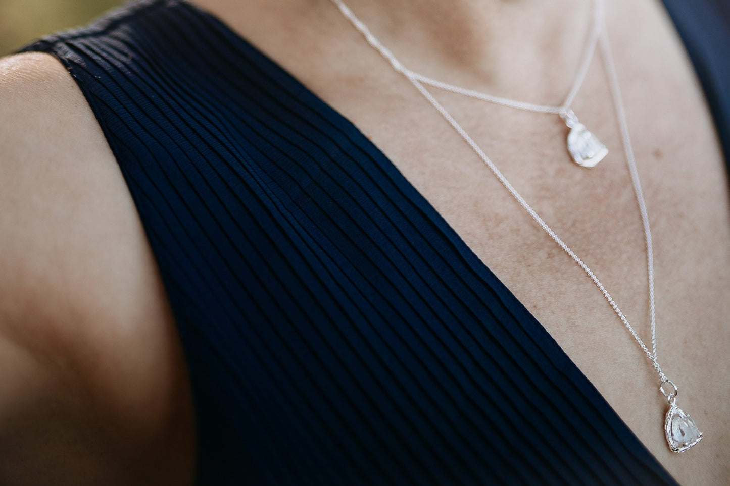 close up of model wearing layered Herkimer Diamond Necklaces