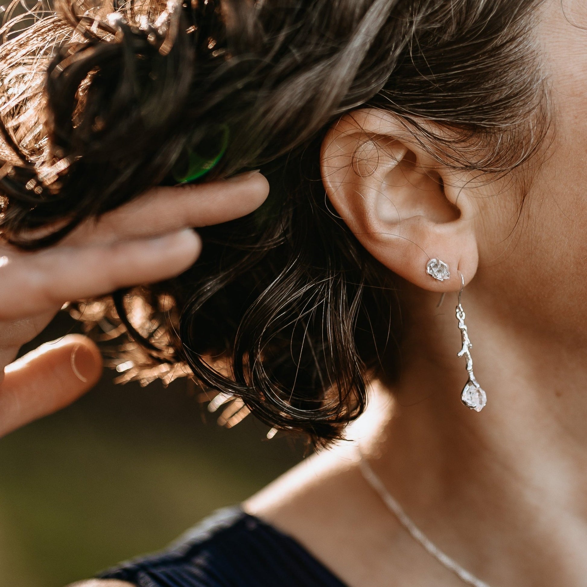close up of Herkimer Diamond silver earrings stack