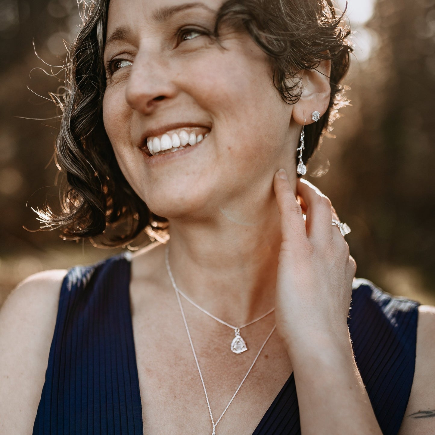 model outdoors wearing Herkimer diamond silver jewelry collection