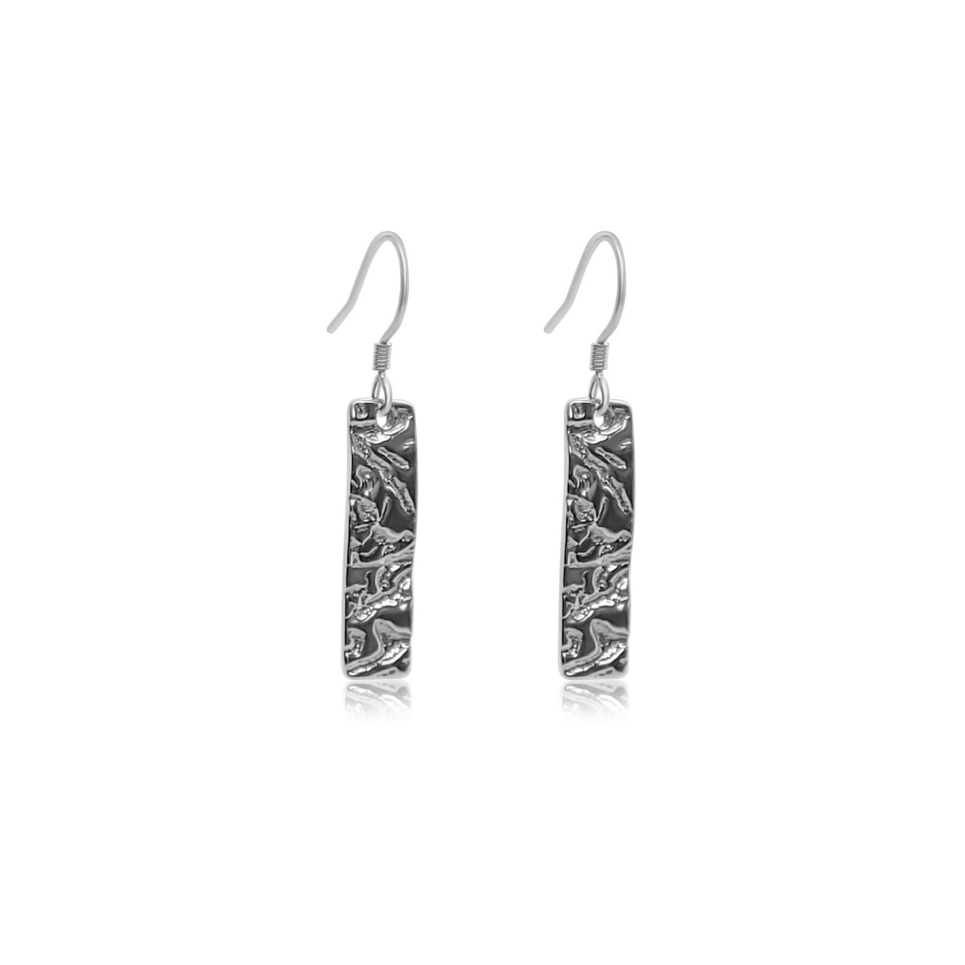 sterling silver drop earrings with thin rectangle pendant with a natural driftwood texture on the silver