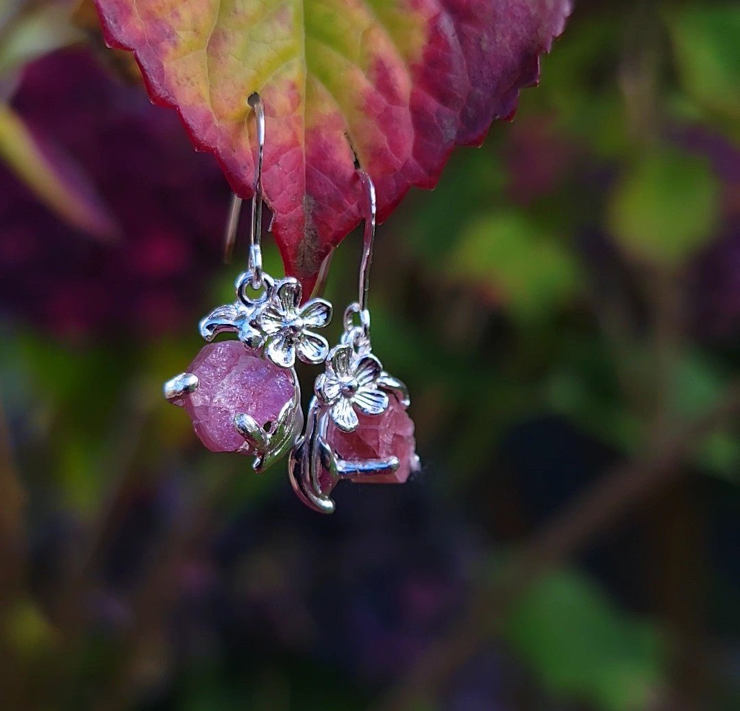 one of a kind silver flower and leaf dangle earrings with raw pink tourmaline gemstones