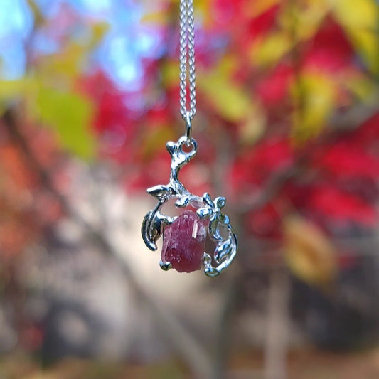 one of a kind sterling silver and natural pink tourmaline pendant necklace with silver flowers and leaves setting.