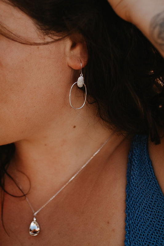 model wearing (zoom) - Cera Shell Textured Sterling Silver Dangle Earrings