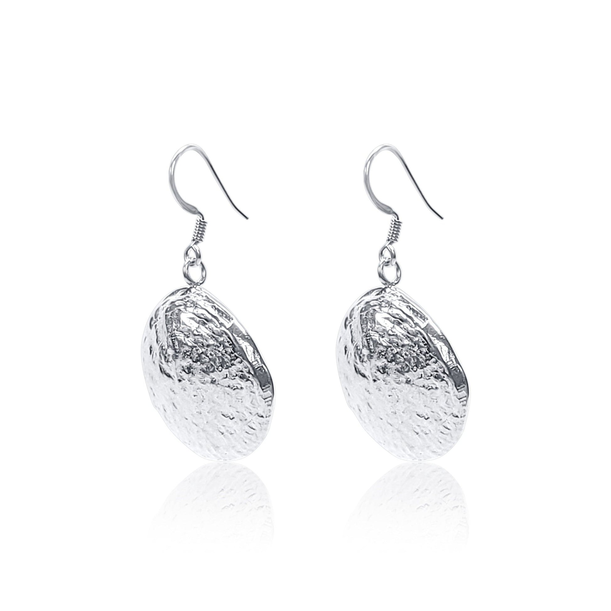 side angle view of sterling silver shell earrings with natural shell texture
