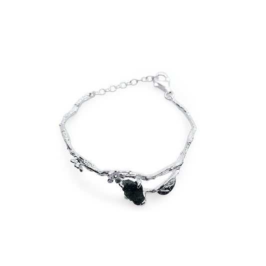 one of a kind silver branch bracelet with silver flowers, leaves and natural raw emerald stone and adjustable closure