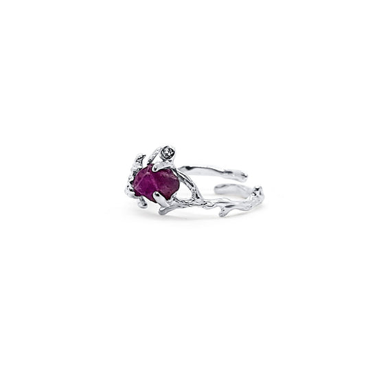 One-of-a-kind, handmade, adjustable silver ring with branch and flower details, featuring raw ruby and zircon.