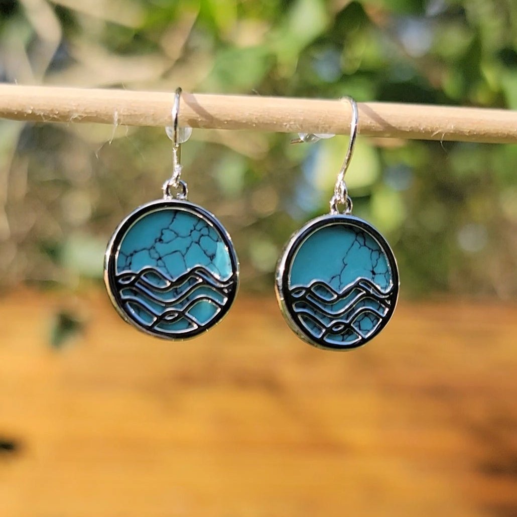 ocean design turquoise silver circle dangly earrings with nature background