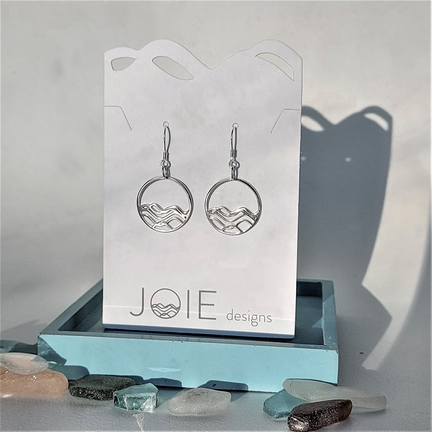 circle earrings, 925 sterling silver petite  high tide in the circle design dangle earring on a white jewelry card