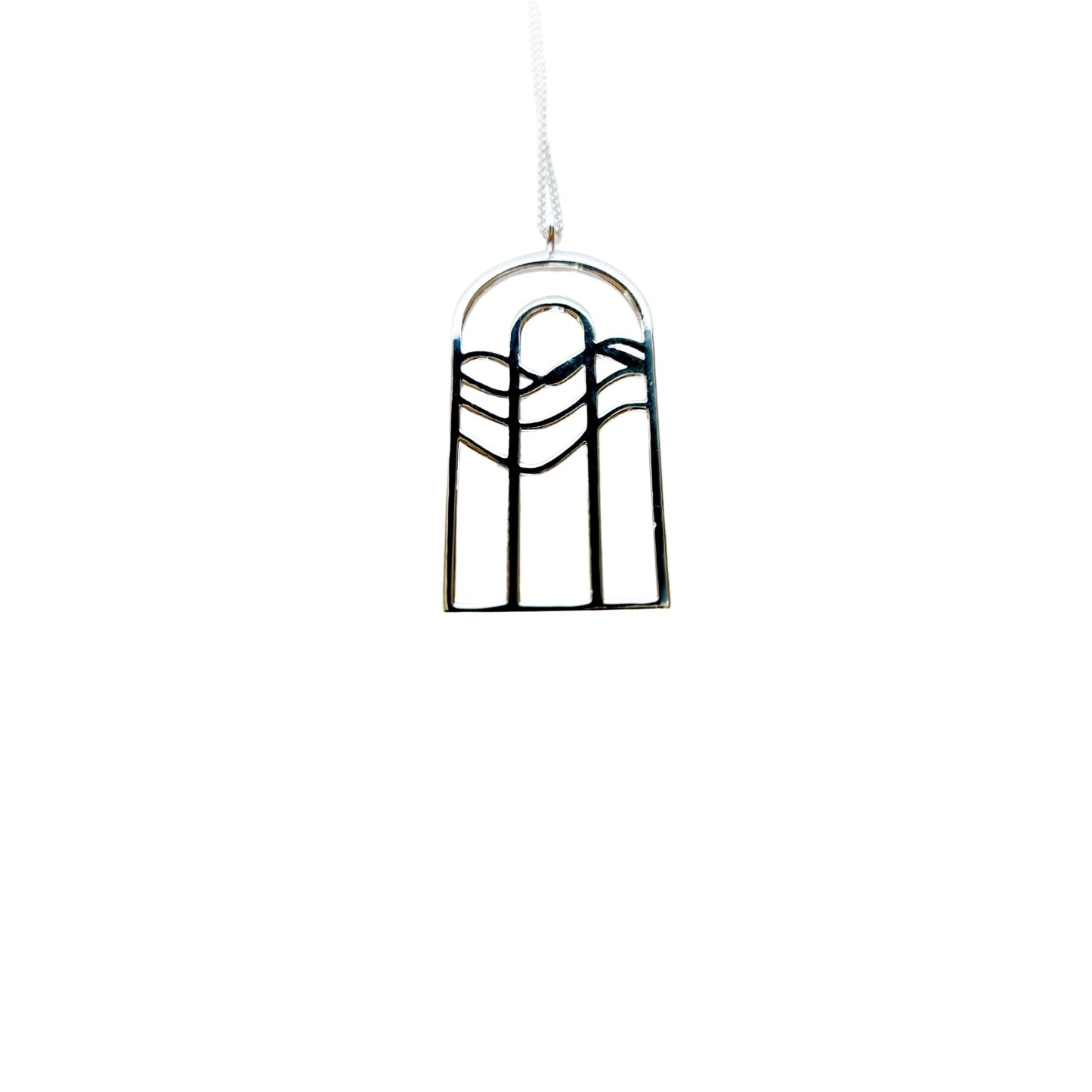 Silver necklace with rainbow water design that resembles cathedral window