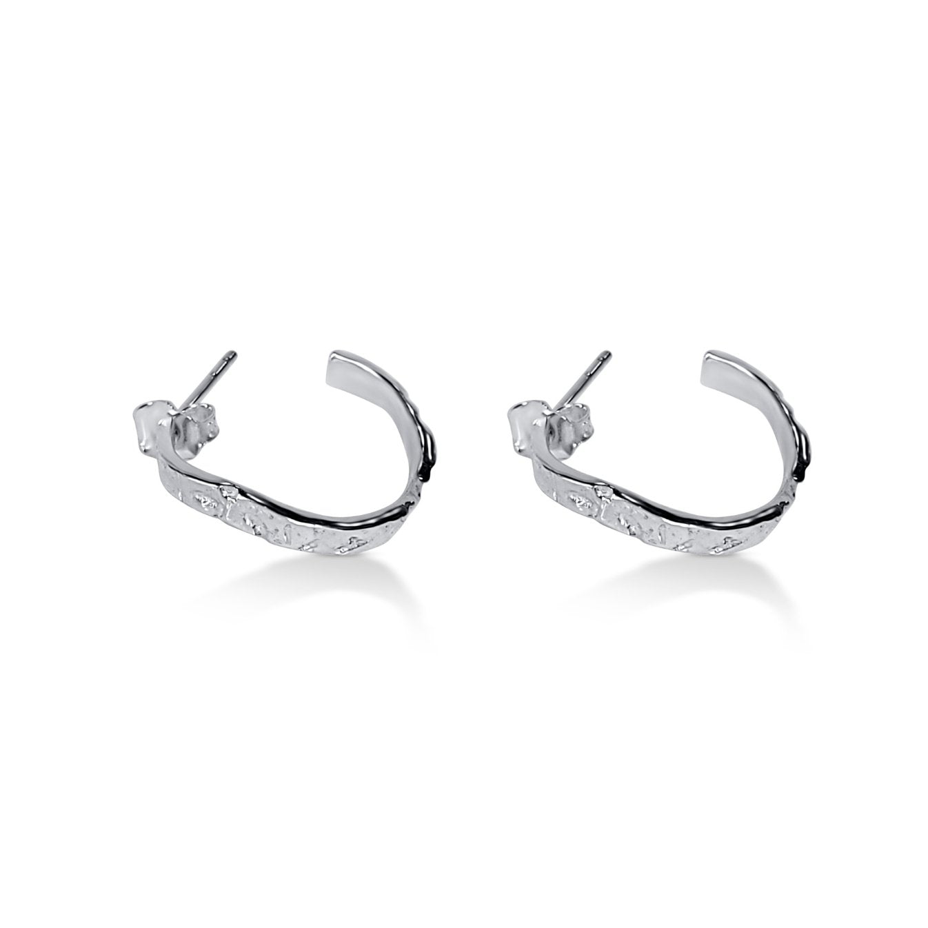 organic wavy lightweight hoop earrings in sterling silver with natural wood texture