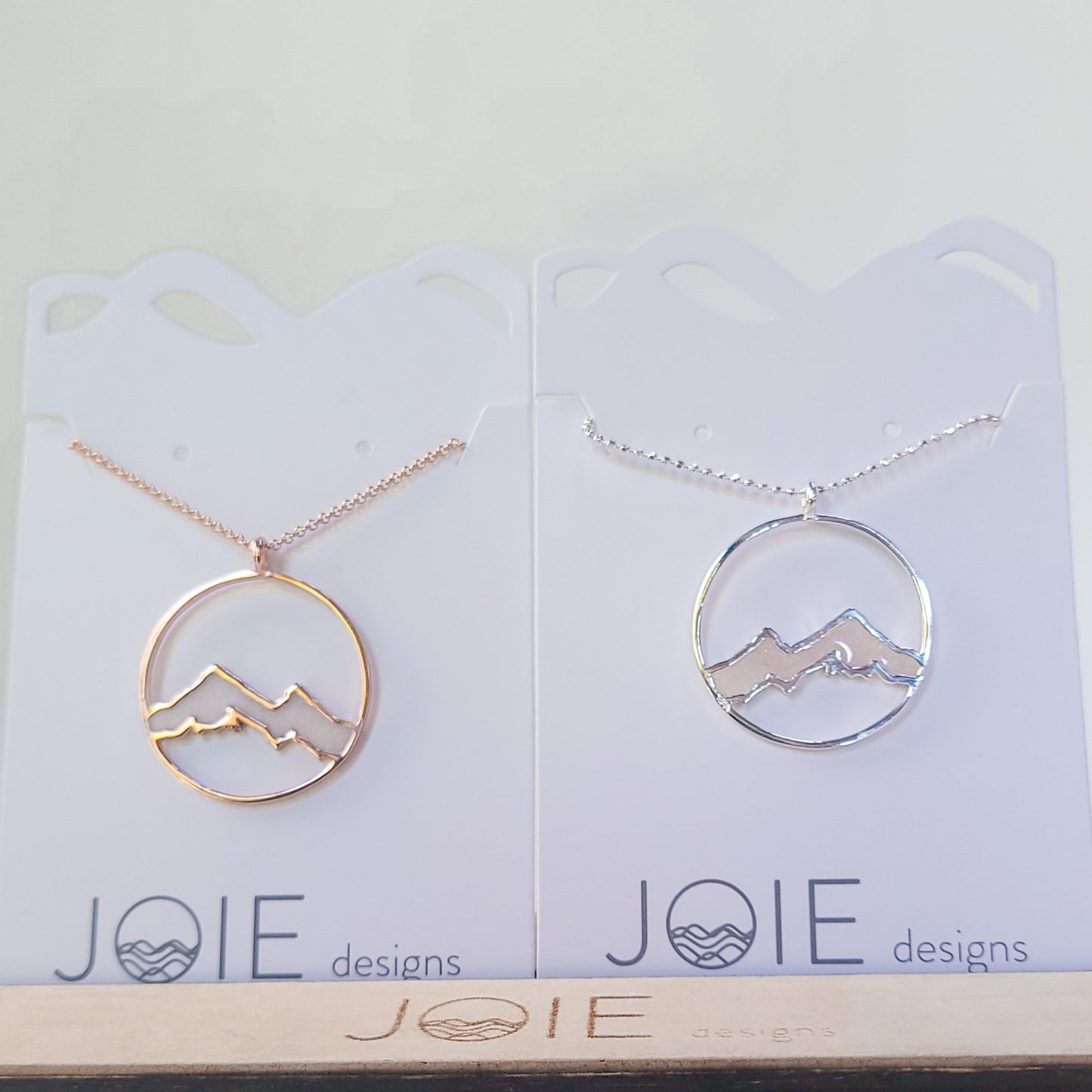 Silver and rose gold Embellished Alpenglow Mountain Necklaces with light pink resin snow caps