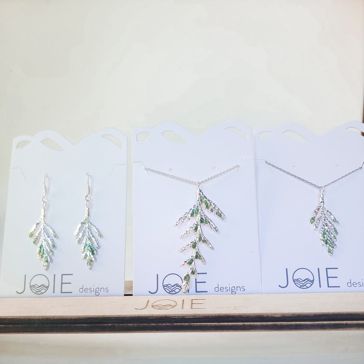 Embellished Silver Thuja and Petite Arborvitae Cedar Leaf Necklaces and matching earrings all with green resin detailing