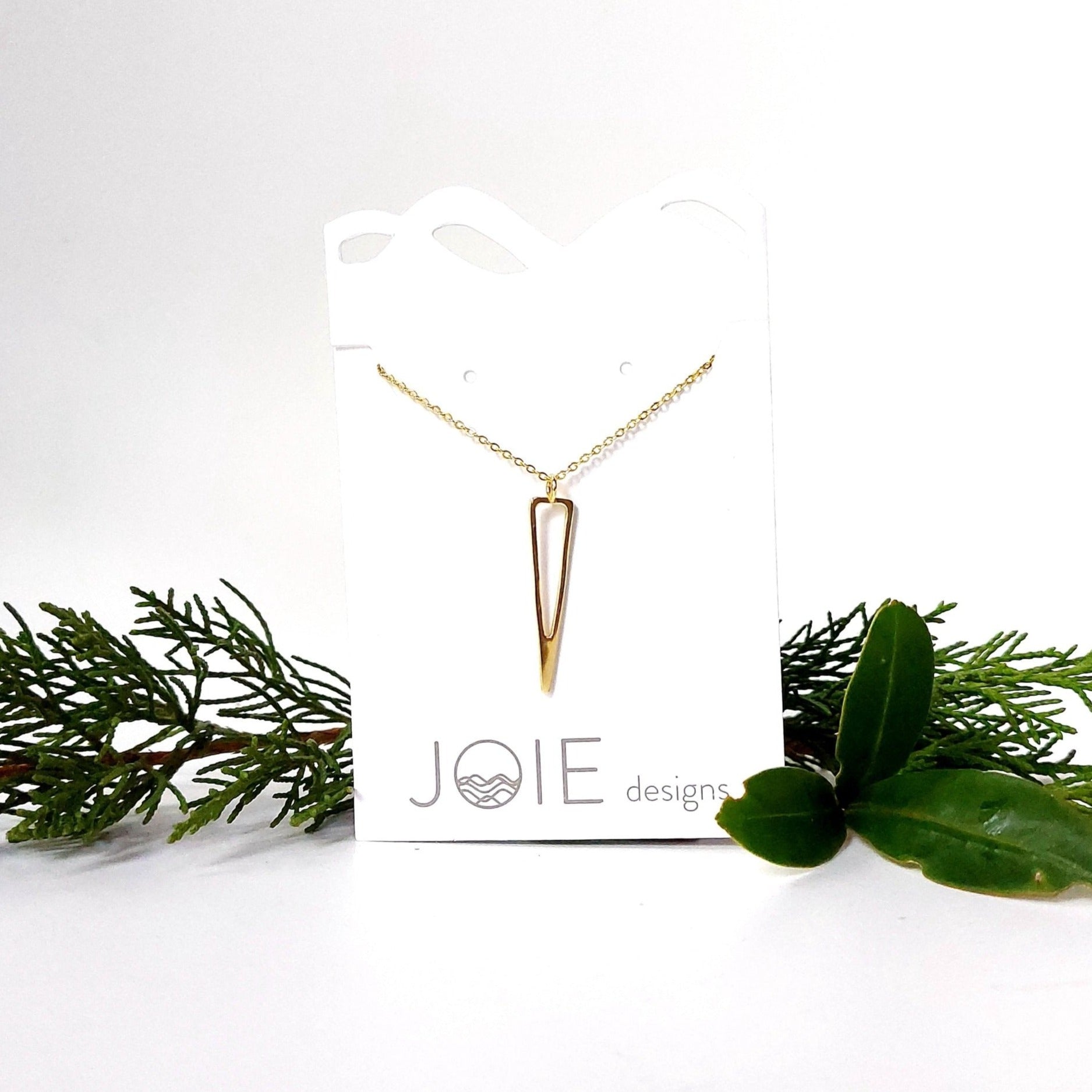 18k yellow gold plated icicle design triangle pendant necklace showcased on a jewellery card with holly and pine on each side