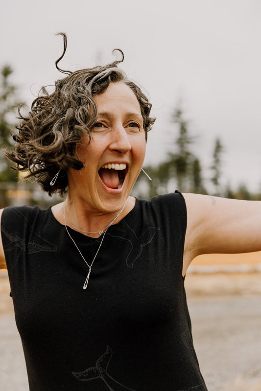 Owner and designer Rosie Harris so happy to be wearing the Indra water drop jewelry collection in sterling silver