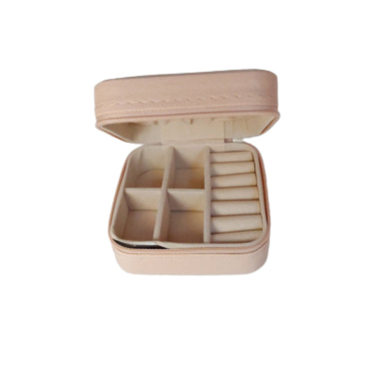 Pink jewelry travel case half open showing inside jewelry compartments