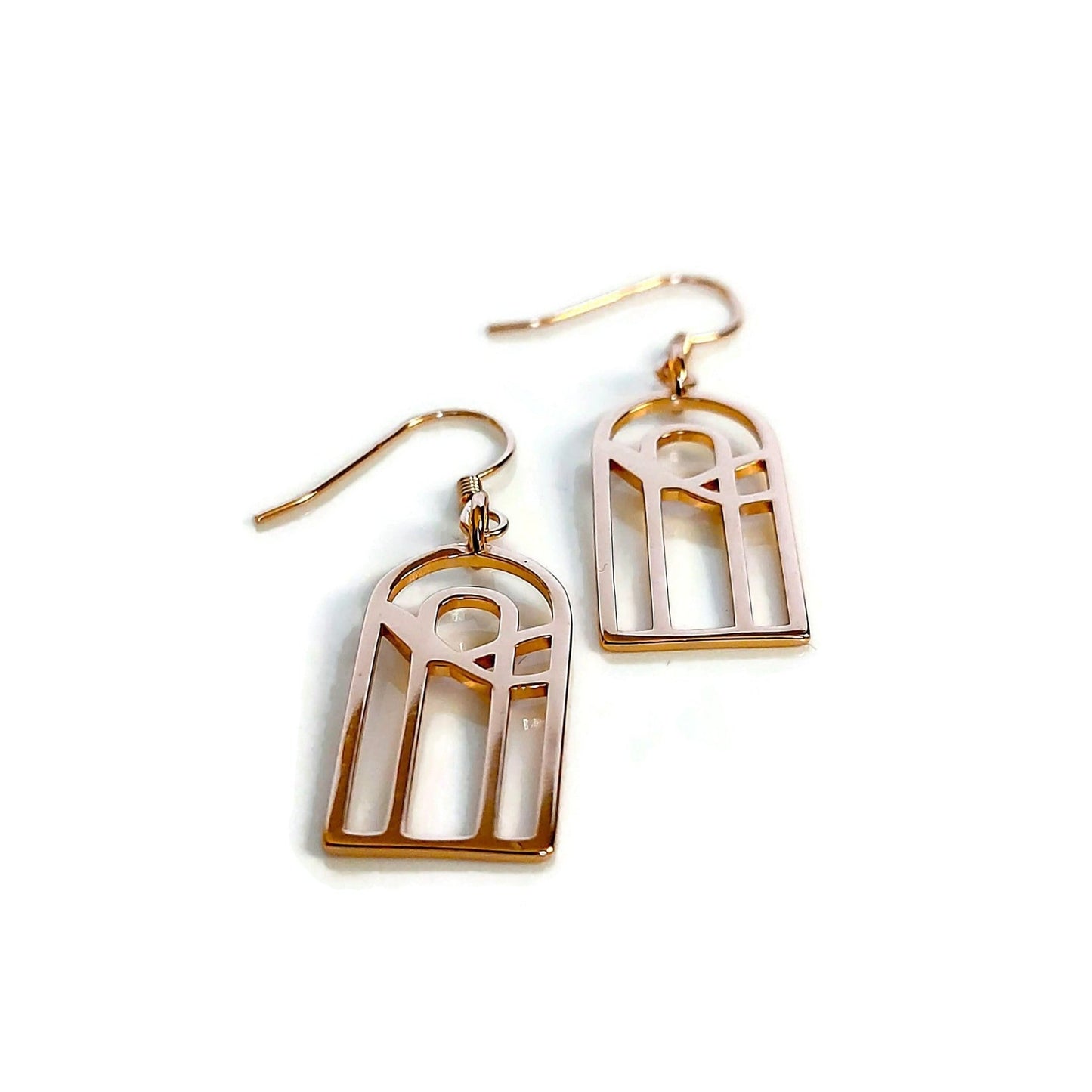 18k rose gold plated kaya rainbow design with water pattern earrings closeup on white background
