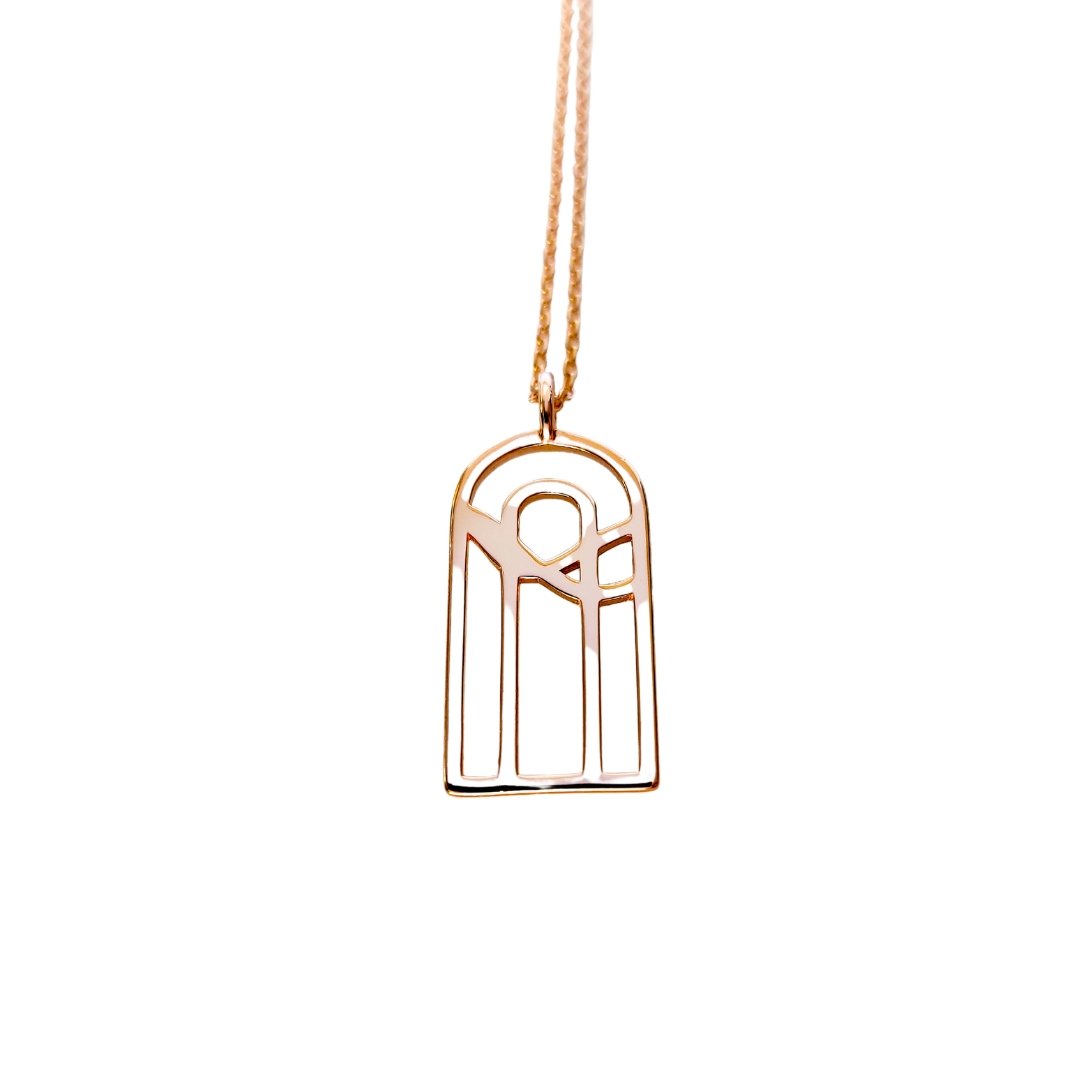 18k gold plated silver double arches with water design on cable chain necklace on white background