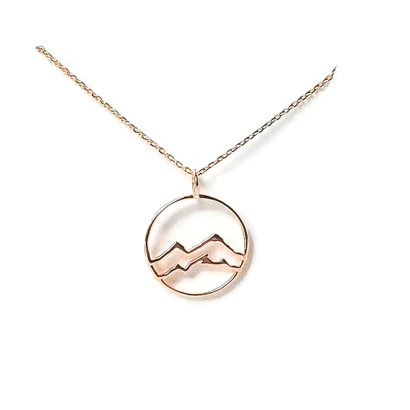 18k rose gold plated little coast mountain circle pendant necklace on white background