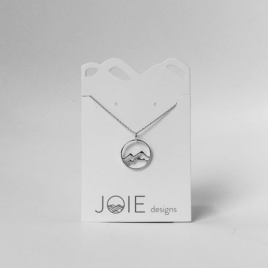 rhodium plated silver little coast mountain circle pendant necklace on white jewelry card