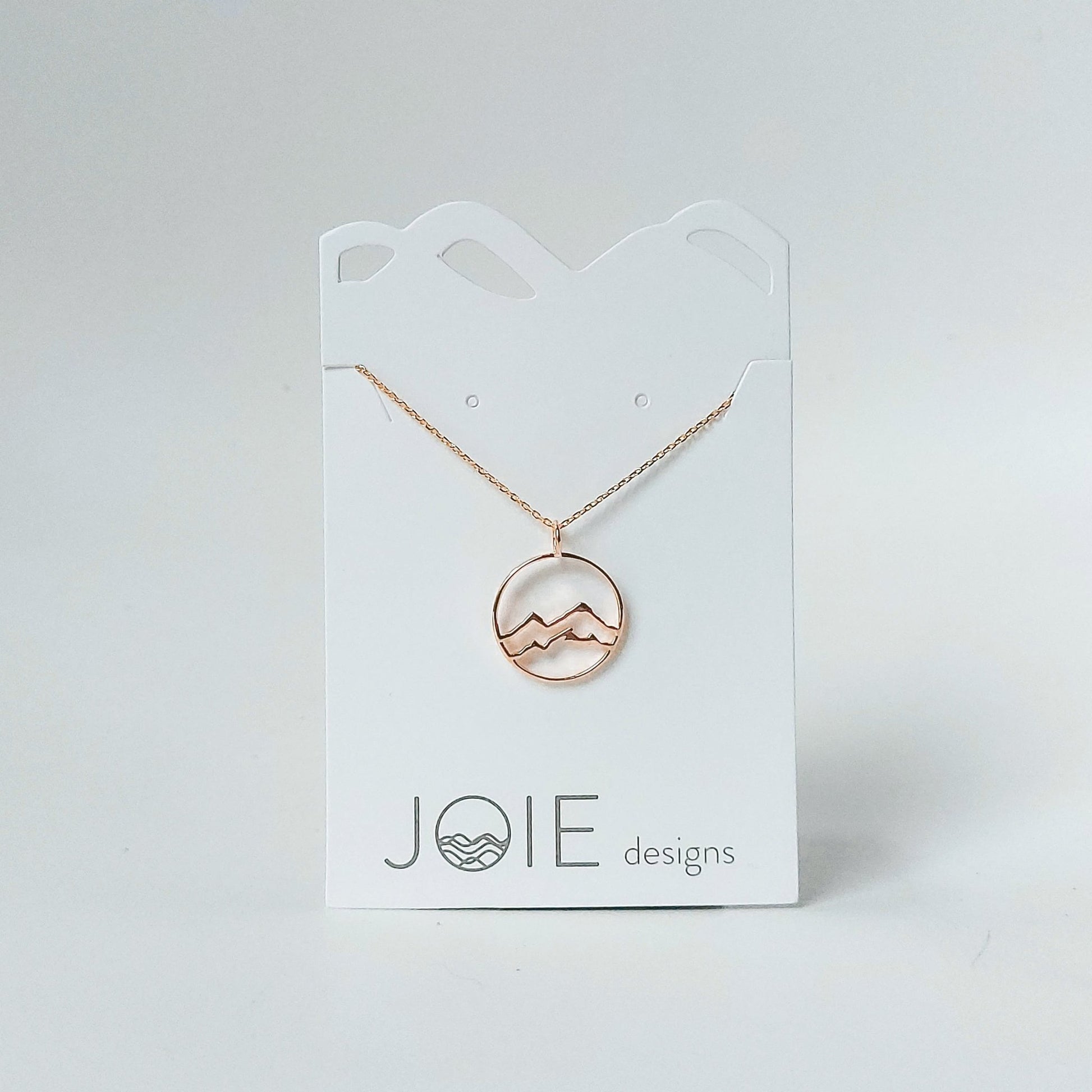 gold plated little coast mountain circle pendant necklace on white jewelry card