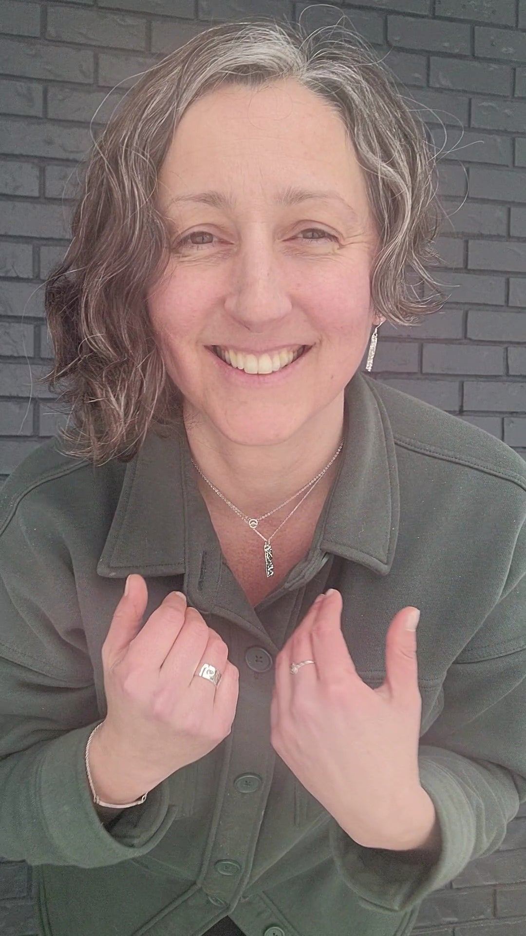 model wearing sterling silver nature inspired jewelry for women- rings, necklaces and earrings