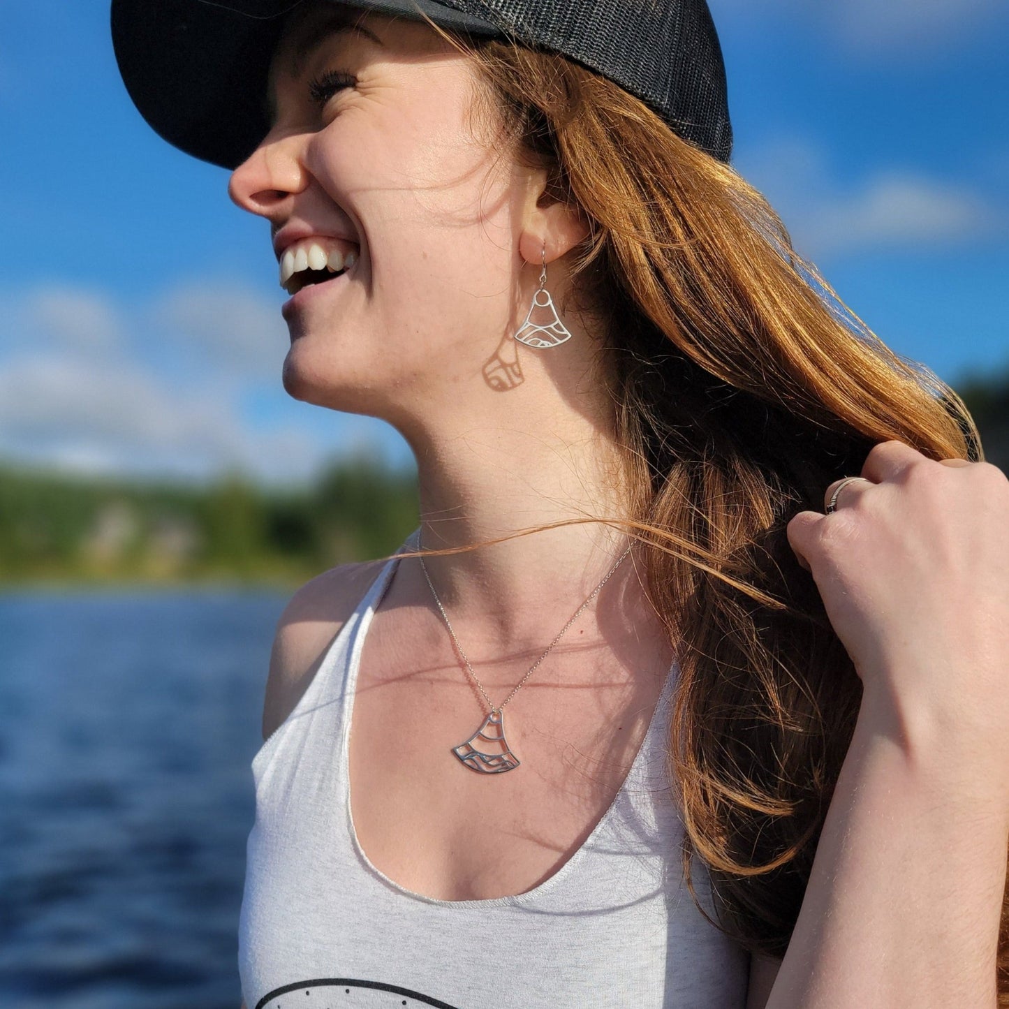 model wearing sterling silver Mei double wave design earrings and necklace
