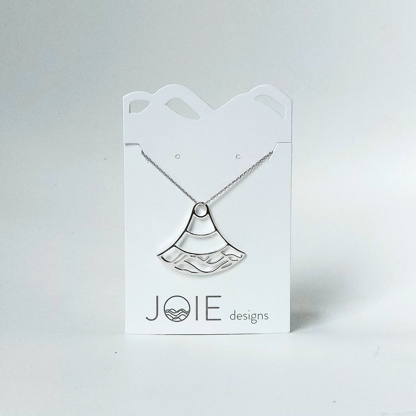 925 sterling silver double water wave Nalu design pendant necklace on a white jewelry card