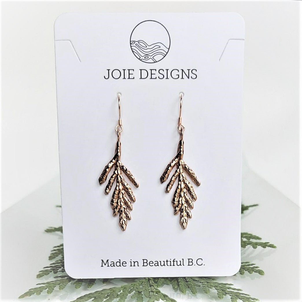 18k rose gold plated cedar leaf  Petite arborvitae Earrings dangle earrings on a jewelry card