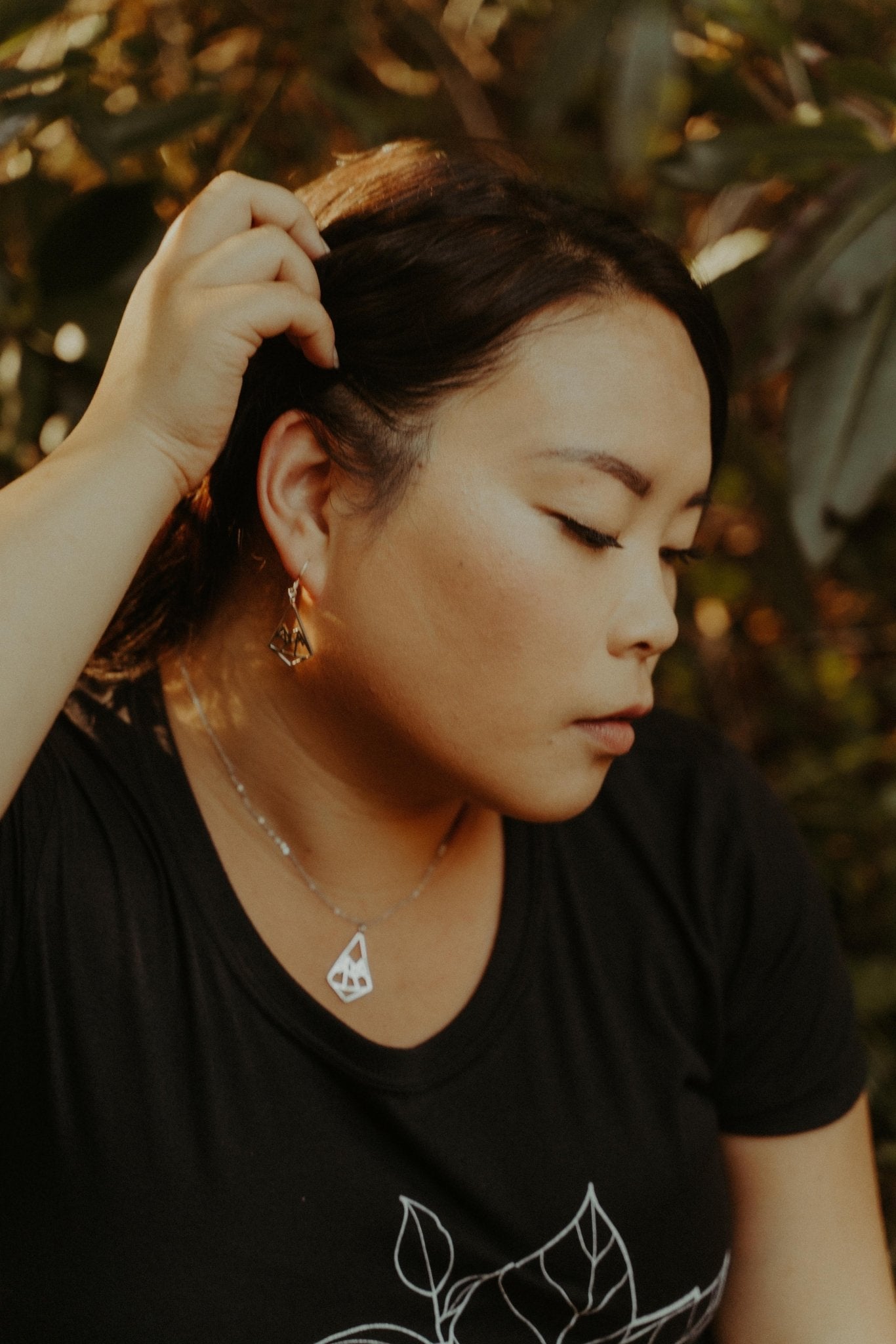 model wearing 18k gold plated geo mountain design dangle earring -2