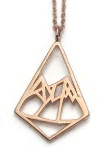 rose gold geometric mountains diamond shape pendant necklace on a white background