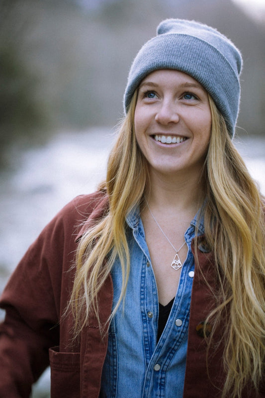 model  outside wearing 925 sterling silver geo mountain design pendant necklace