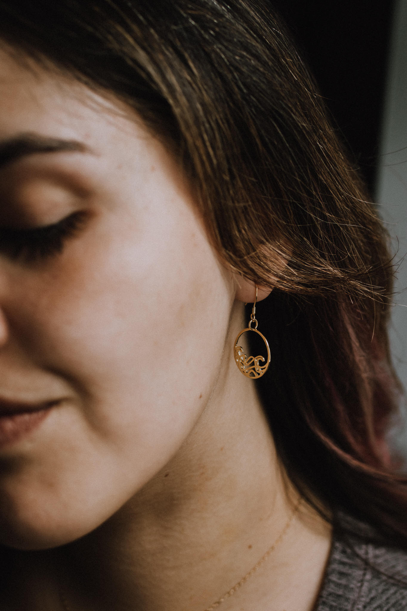 model wearing 18k gold plated circle earrings, ocean jewelry, wave earrings, dangle earrings