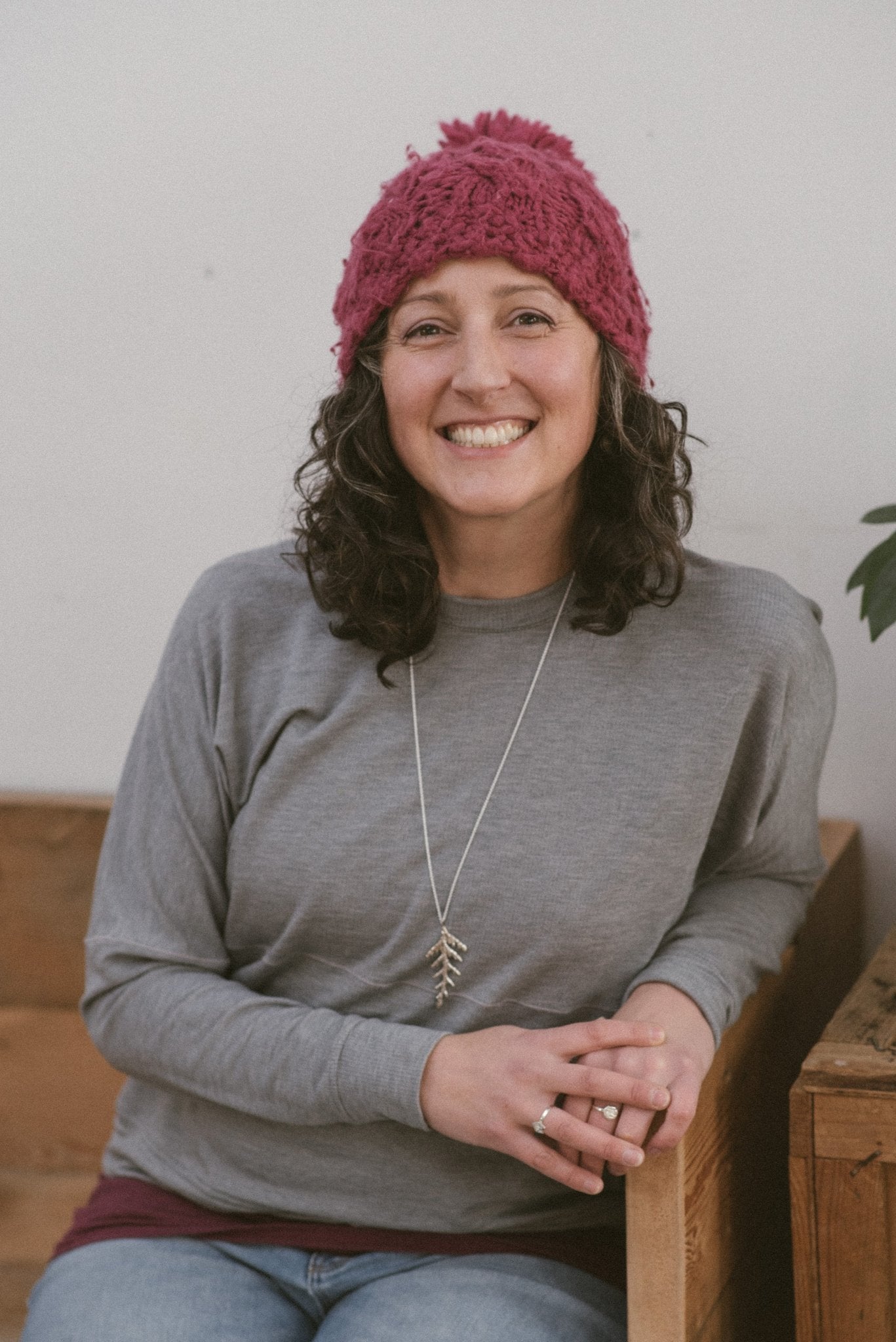 Jewelry designer wearing silver Thuja cedar leaf necklace
