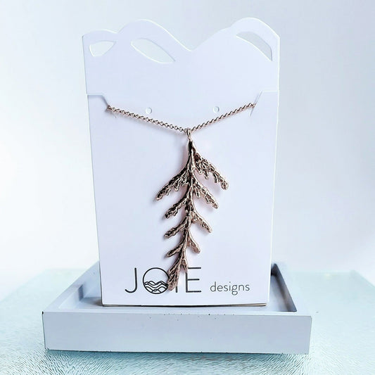 Nature-inspired cedar leaf necklace in 18k rose gold plating
