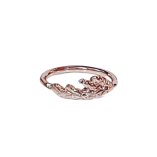 18k plated rose gold cedar leaf thuja ring on white background