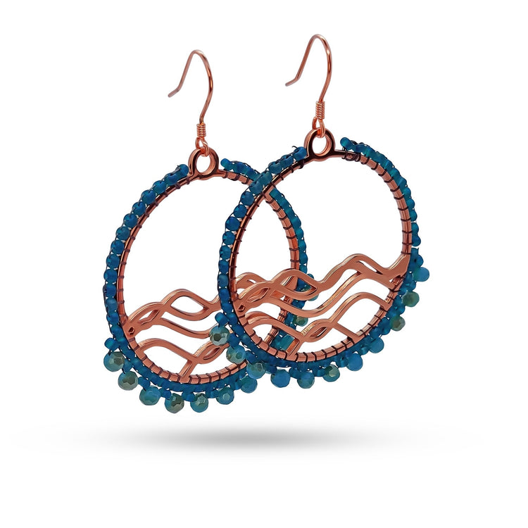 Rose gold High Tide Ocean Earring hand beaded by indigenous bead artist with blue bead wrap and fringe