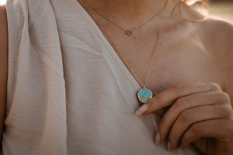 happy model in nature wearing her mountain bike necklace