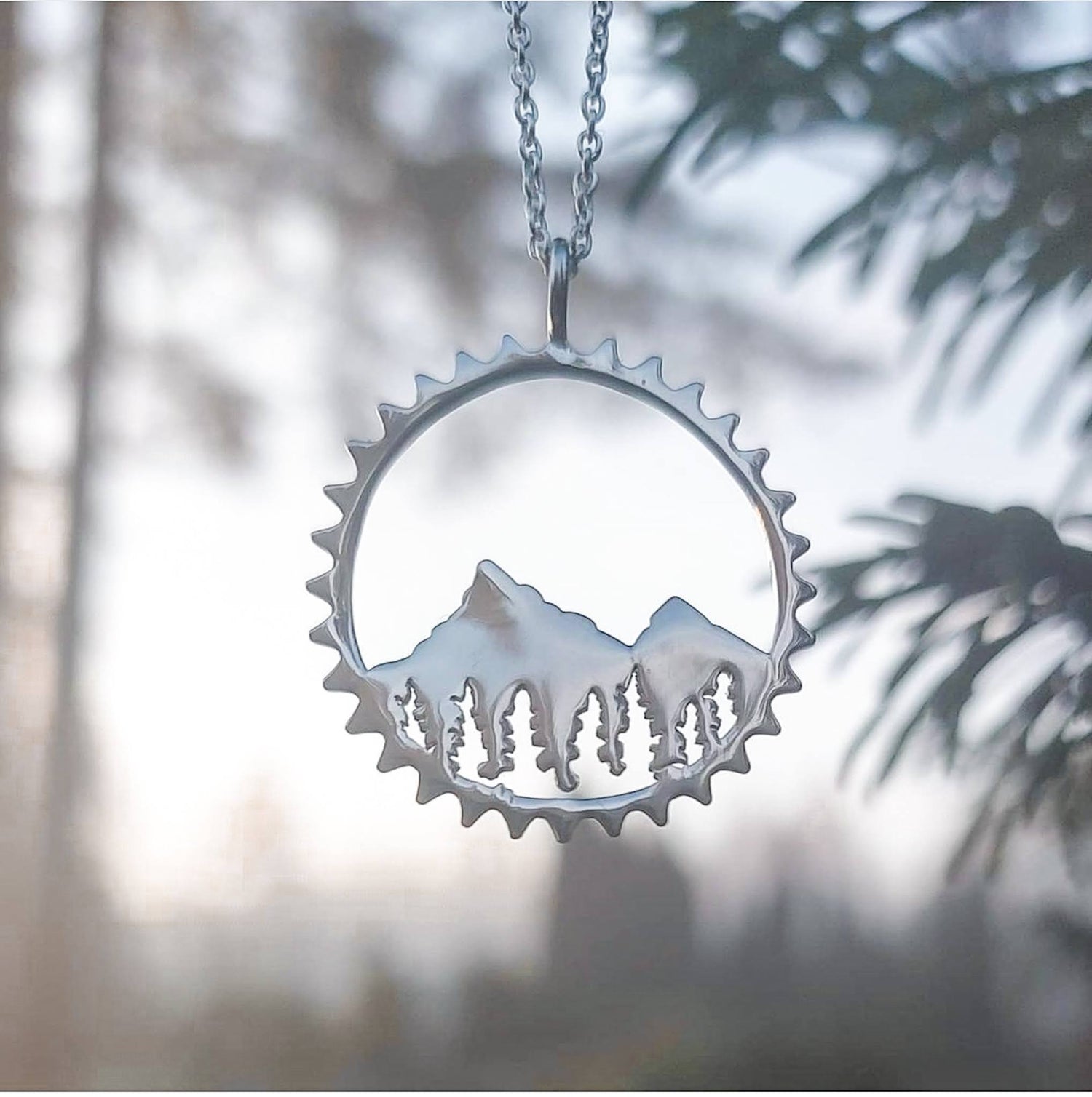 Sterling  silver Amore Mountain and forest pendant necklace with nature sunset background