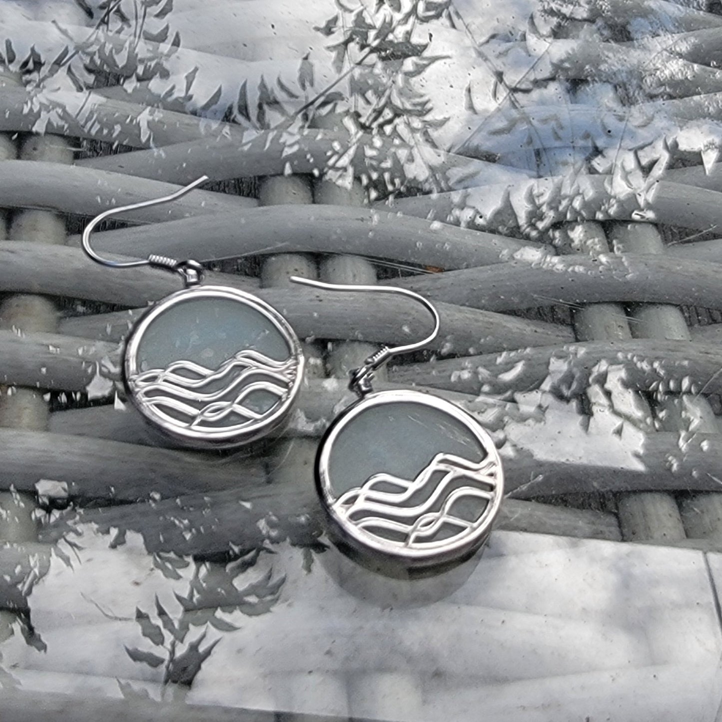 amazonite gemstone earrings. silver dangle earrings with ocean wave design on reflective surface