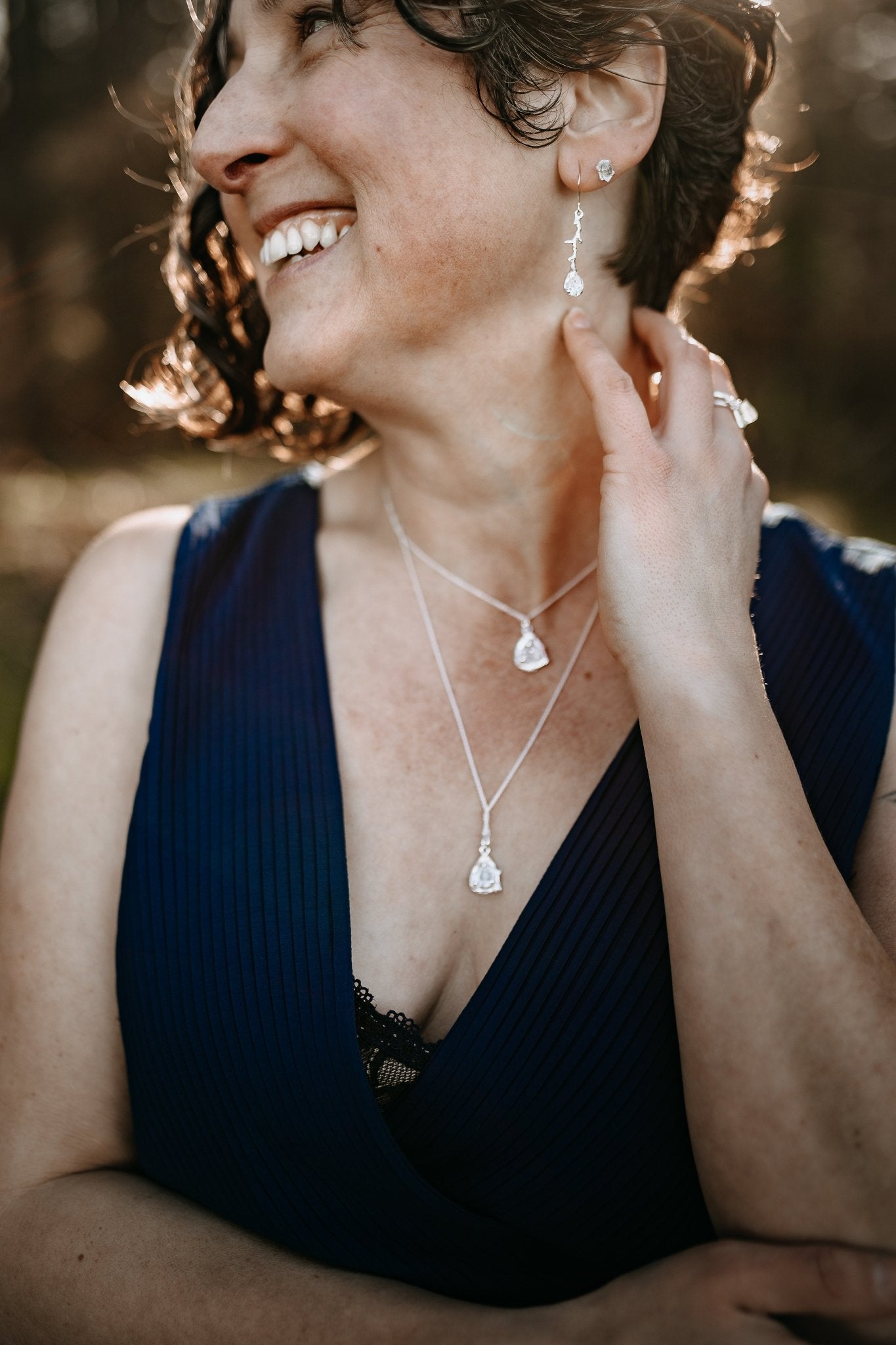 model wearing Herkimer diamond collection of necklaces, earrings, studs and ring
