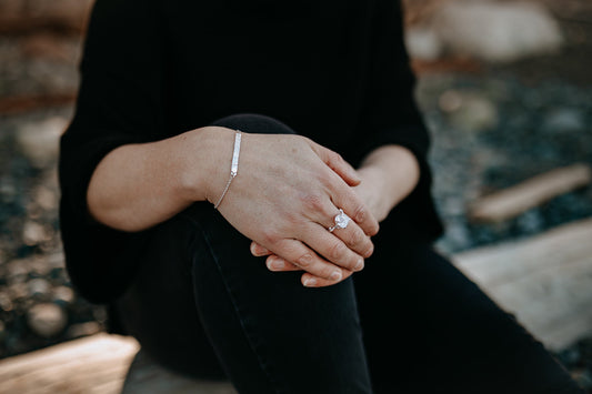 close up of model's hand wearing natural  herkimer diamond ring with claw settings