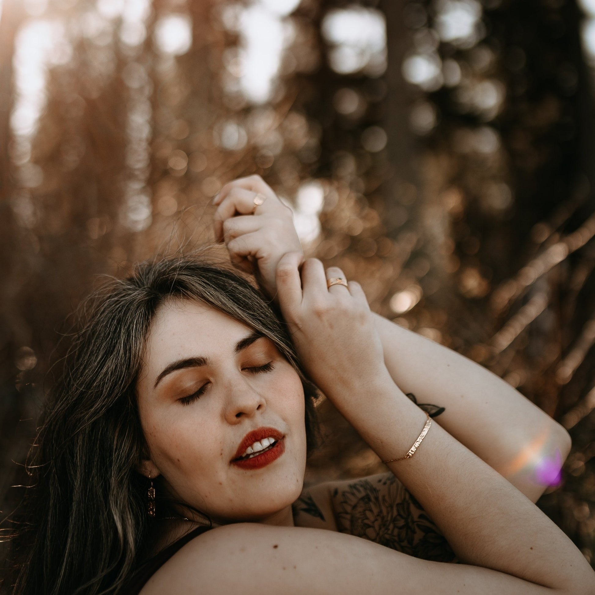 model wearing gold Kayla adjustable bar bracelet