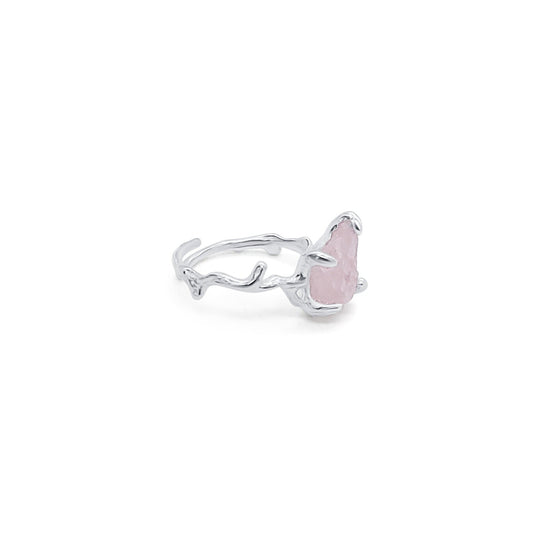 side view of adjustable silver and natural rose quartz ring with prong setting