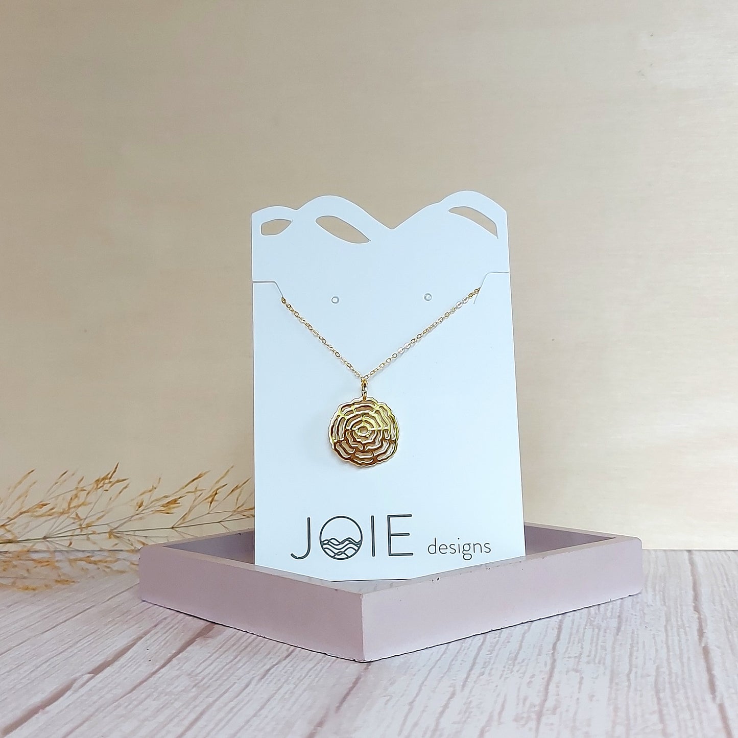 18k plated yellow gold plated Vita Tree ring pendant necklace with heart center cut out on white jewelry card