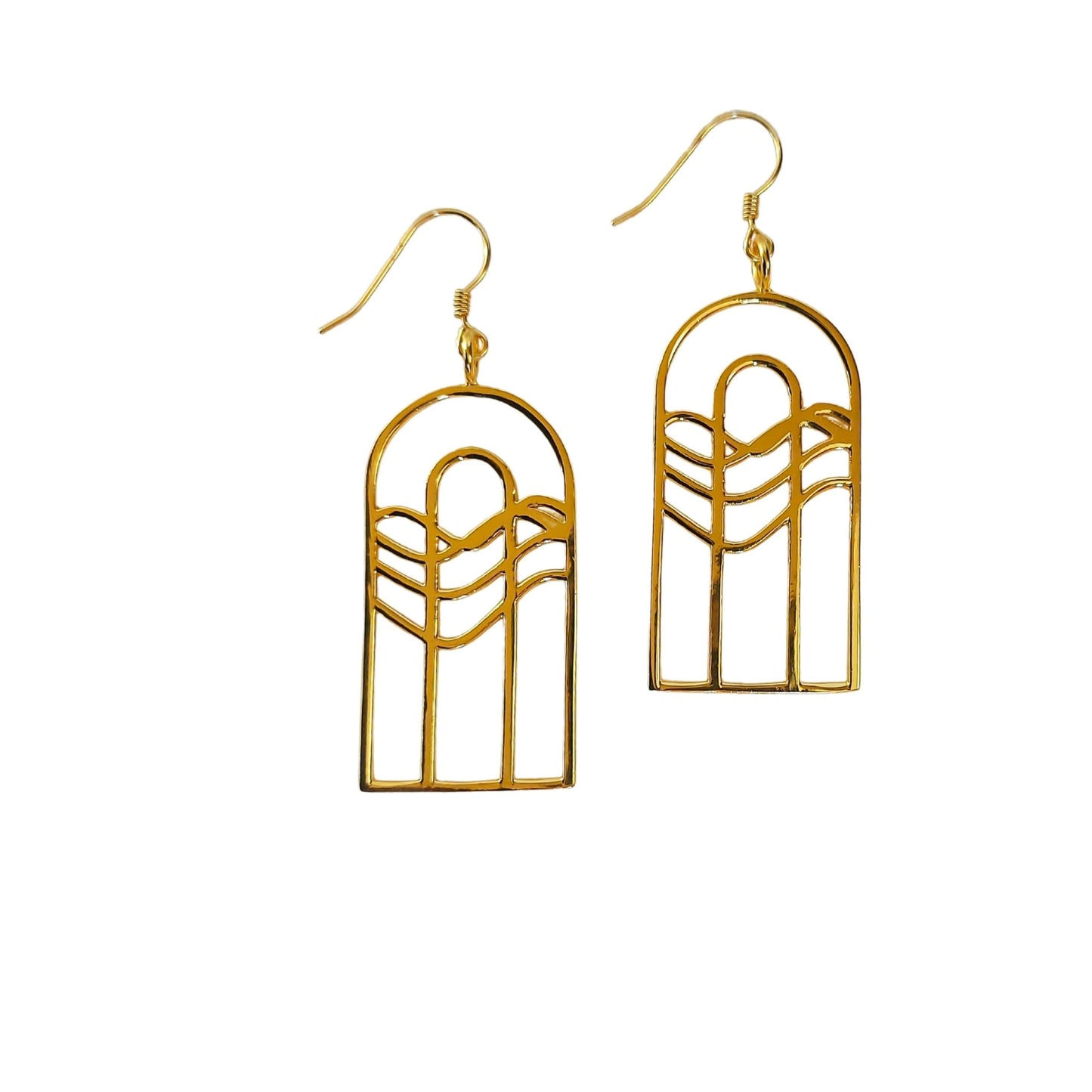 danlge earrings of gold plated concentric half stadiums with organic lines flowing down to the left.