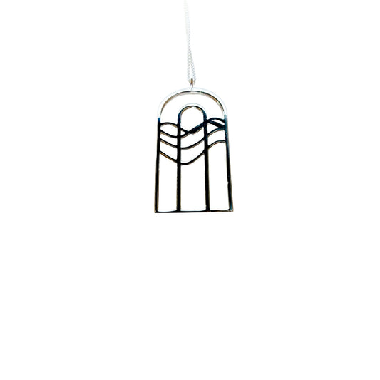 Silver necklace with rainbow water design that resembles cathedral window
