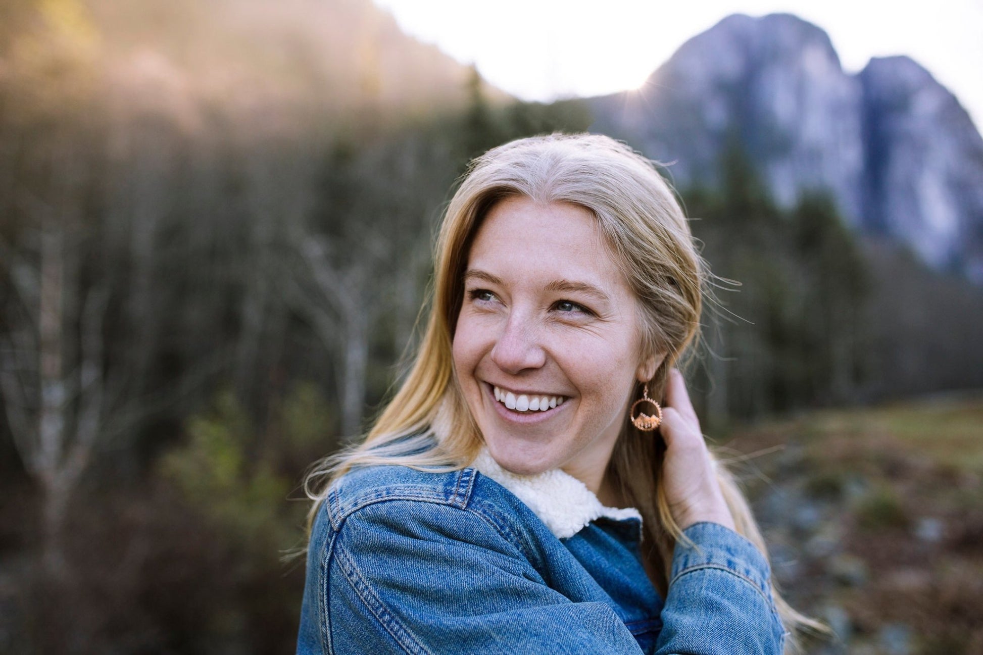 18k gold plated earrings shown on smiling model with the Stawamus chief behind her