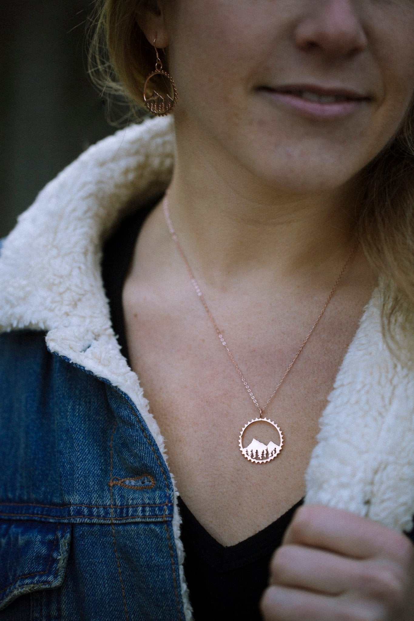 model wearing gold vermeil mountain bike inspired circle pendant necklace